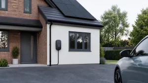 Home EV charger on a tidy UK house with roof solar panels.